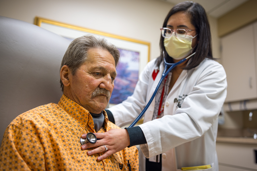 Physician treating patient