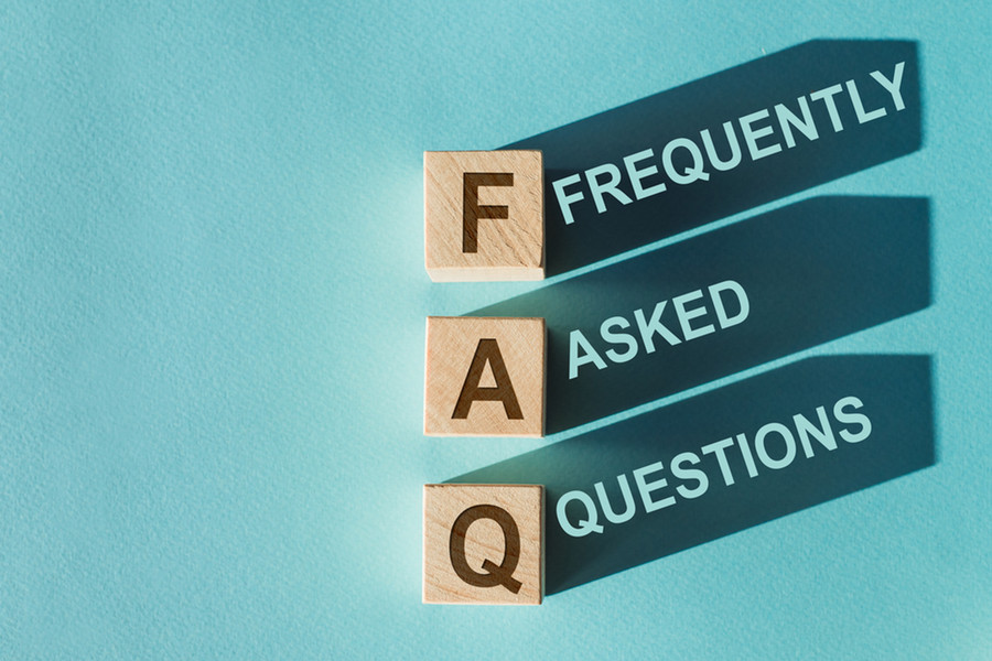 Three tiles with the letters F, A, and Q that spell out Frequently Asked questions on turquoise background