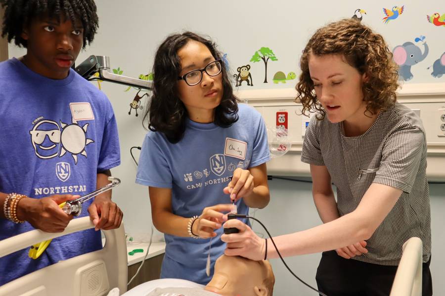 two kids and doctor intubating hospital dummy