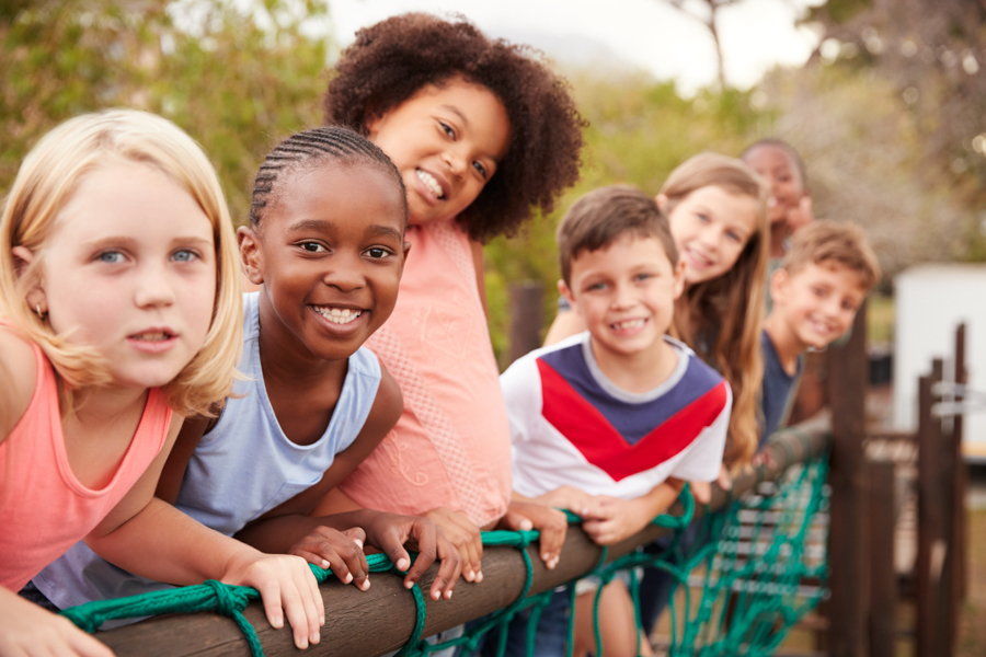 group of kids lined up looking at camera