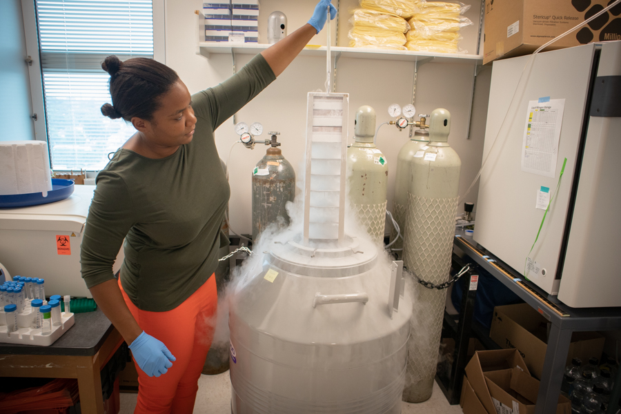 Woman demonstrating cooling lab equipment