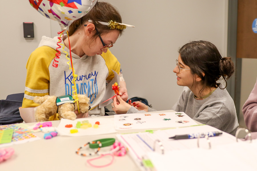 nurse talking to pediatric study participant
