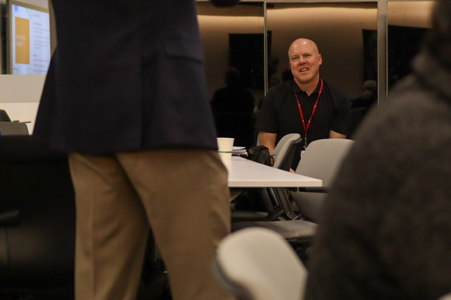 man sits at table at event