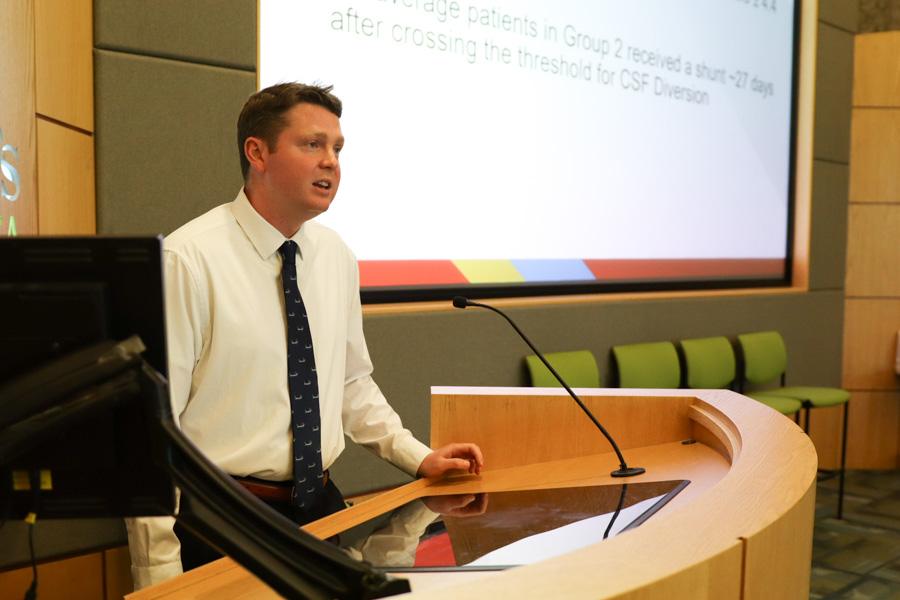 man presenting at podium