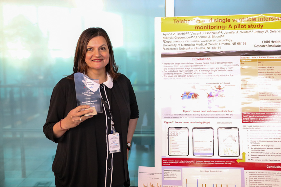 Woman holds research award
