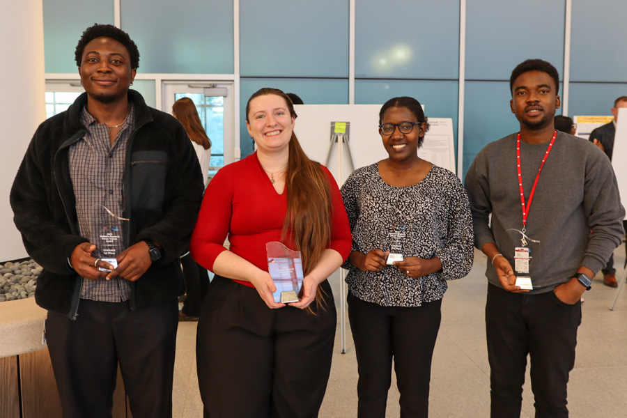 Research winners hold awards in group photo