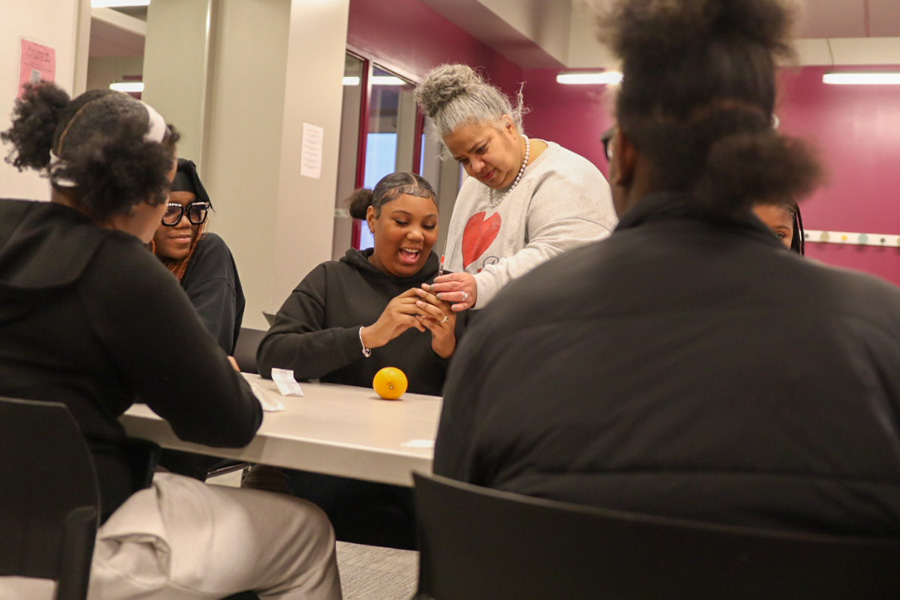 doctor works with Girls Inc. participant