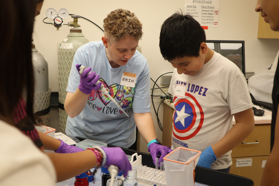 kids being taught how to use lab equipment