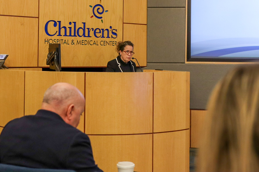 woman talking at podium at CHRI Cardiology Mini Summit