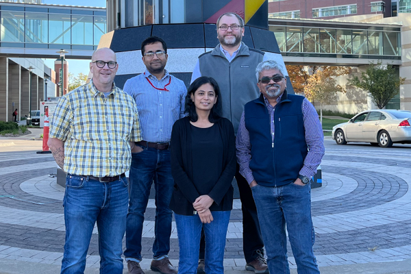 Nebraska Pediatric Drug Discovery Group members standing outside on UNMC campus