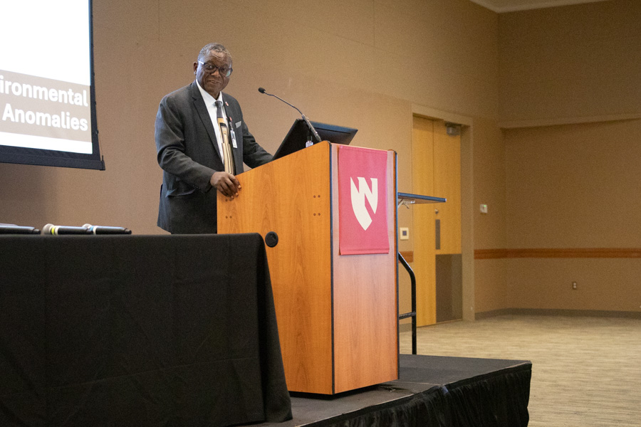 Dele Davies, MD, speaks at podium