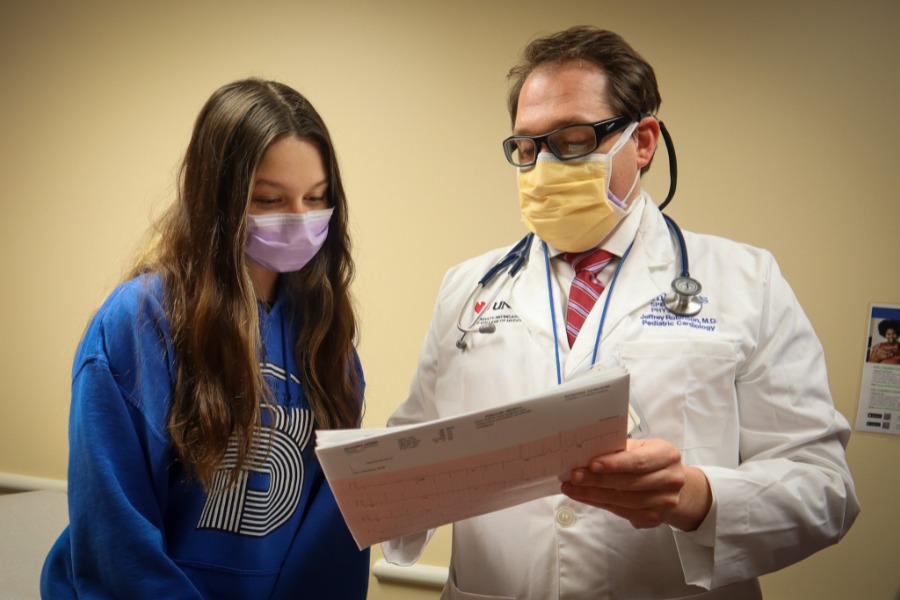 Doctor showing results to adolescent female patient