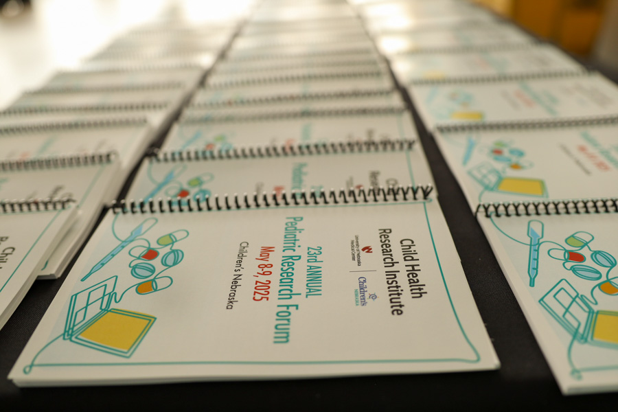 CHRI Research Forum brochures sitting on a table