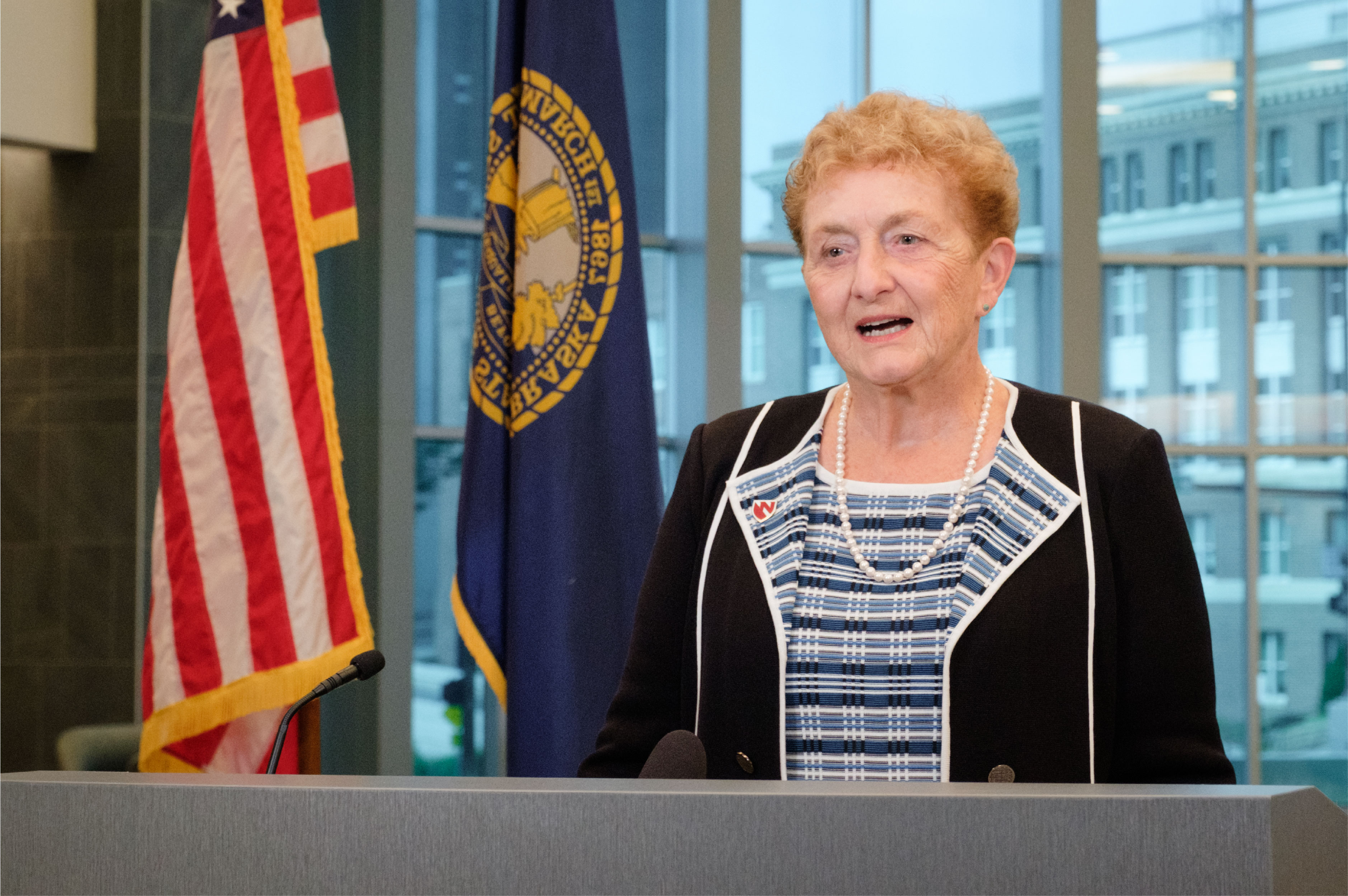 Faculty member Pamela Boyers stands behind a podium