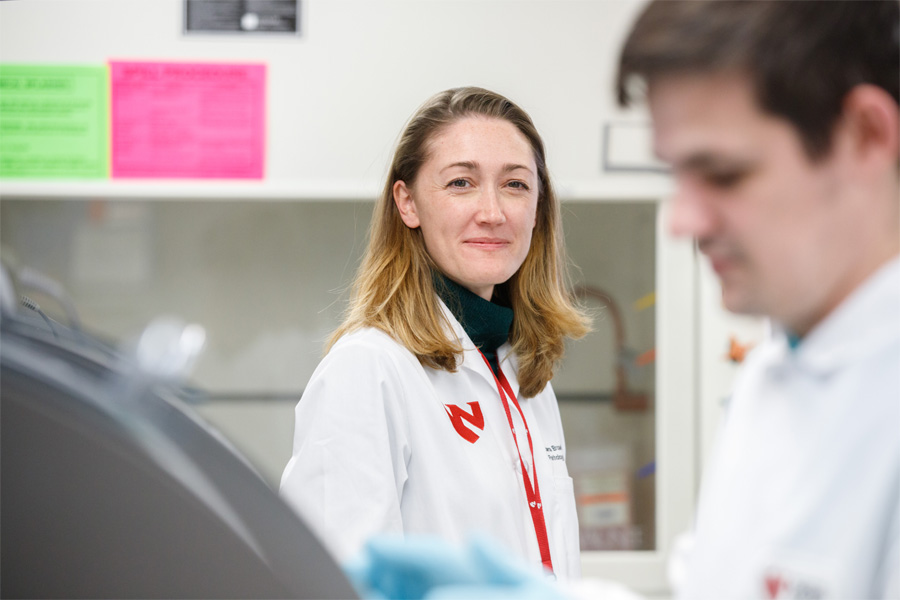 M. Jana Broadhurst, MD, PhD, director of the Nebraska Biocontainment Unit Clinical Laboratory with her team at work in the foreground