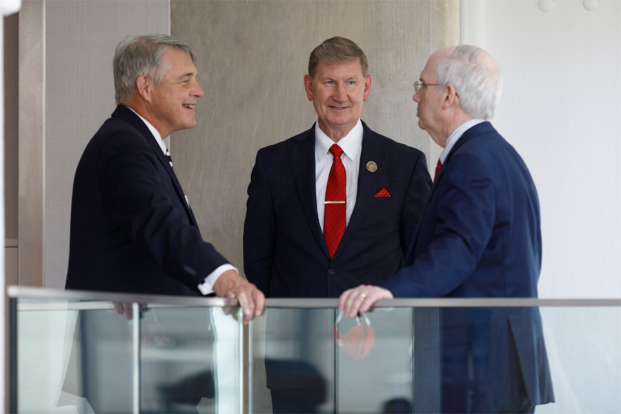 Drs. James Linder, Ted Carter and Jeffrey Gold speak together at an event