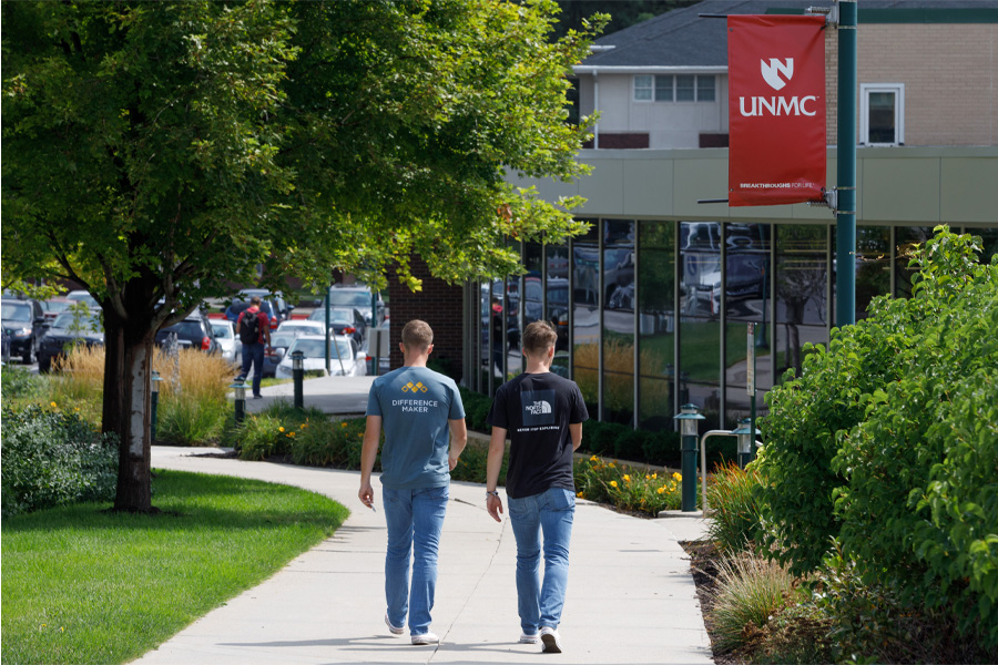 Two students walk on the UNMC campus