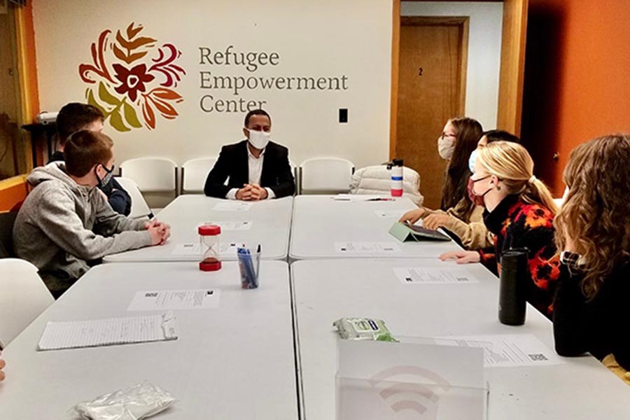 Medical students meet with Rohullah Niazi, manager of community initiatives at the Refugee Empowerment Center.