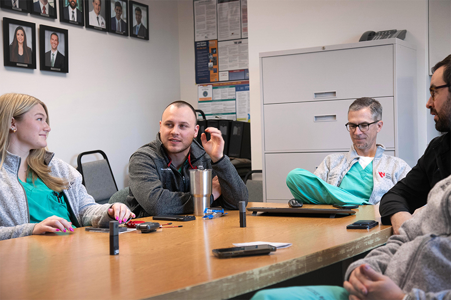 Urology residents discuss cases at weekly case conference.
