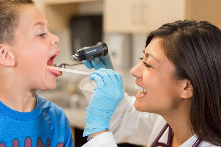 A physician works with a patient