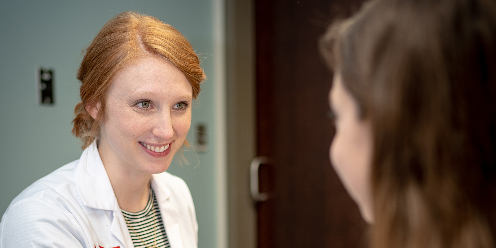 Dr. Megan Arthur examining a patient