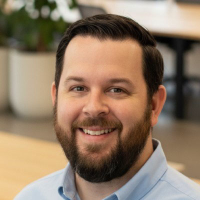 Tim Krayer poses for a headshot