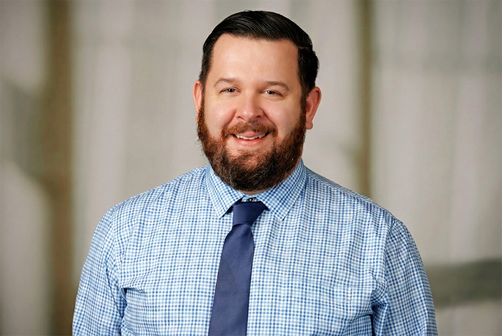 Tim Krayer poses for a headshot