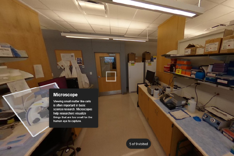 A view inside a biomedical research laboratory with workbenches on both sides