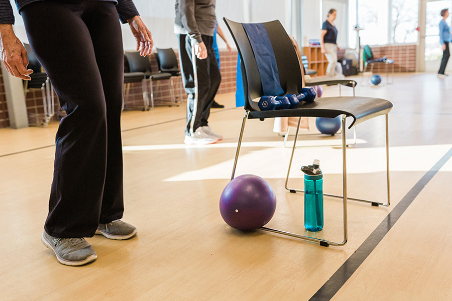 Participants in a group movement class at UNMC's Engage Wellness Medical Fitness Facility