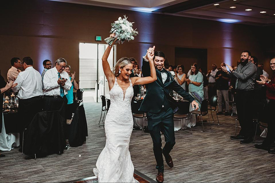 A newly married couple dances during their reception in the UNMC Truhlsen Events Center.