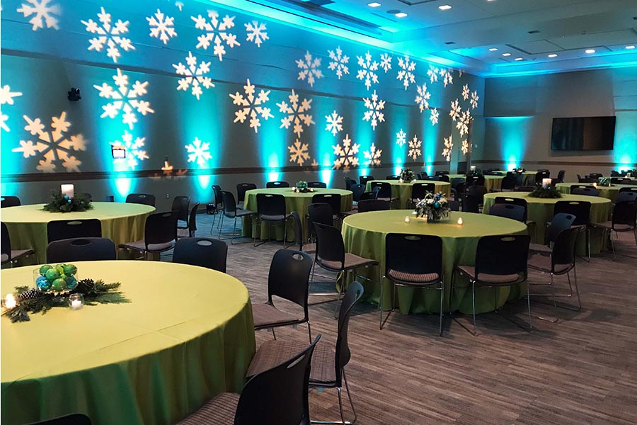 Dramatic snowflake lighting in the Events Center for a holiday party.