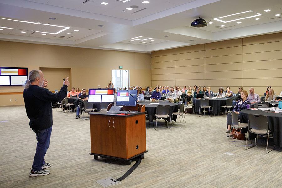 A speaker presents at a conference.