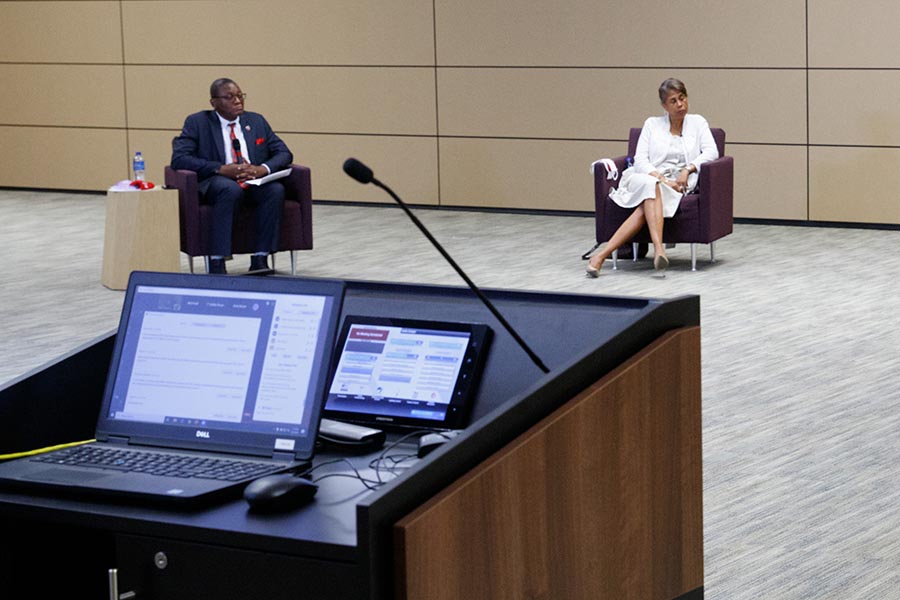 Presenters speak at an event in the Truhlsen Campus Events Center.