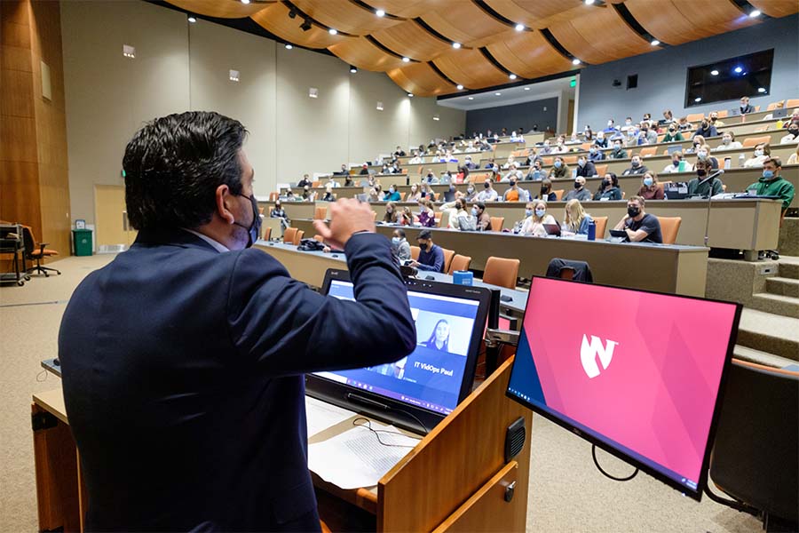 faculty presenting a lecture to students