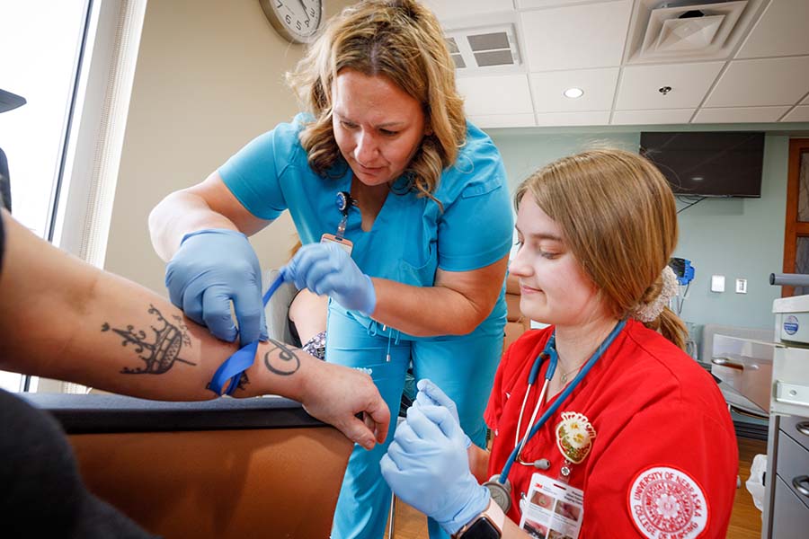 student learns to draw blood