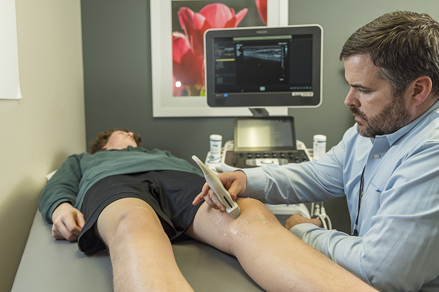 sports medicine ultrasound on patient knee