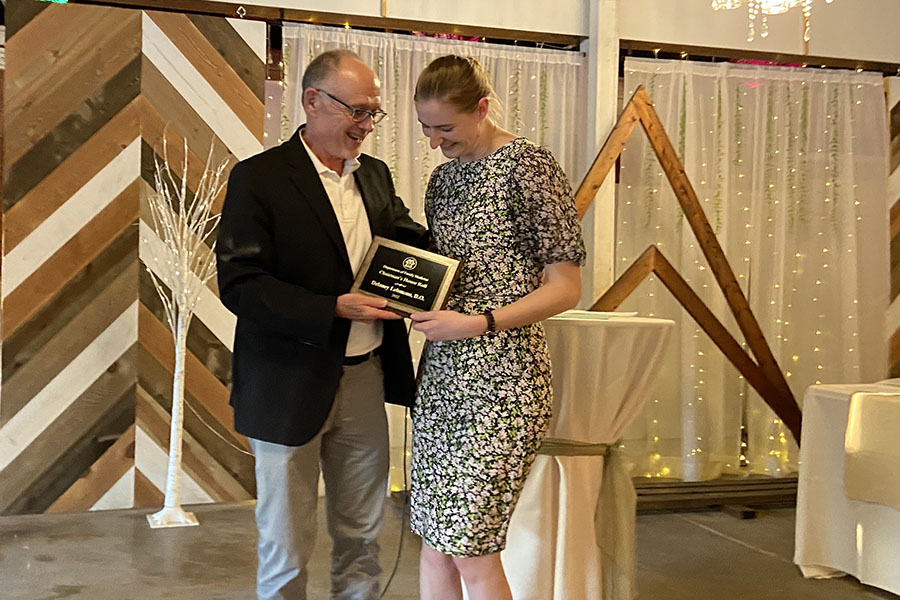 Dr. Harrison presents award to Delaney Lehmann