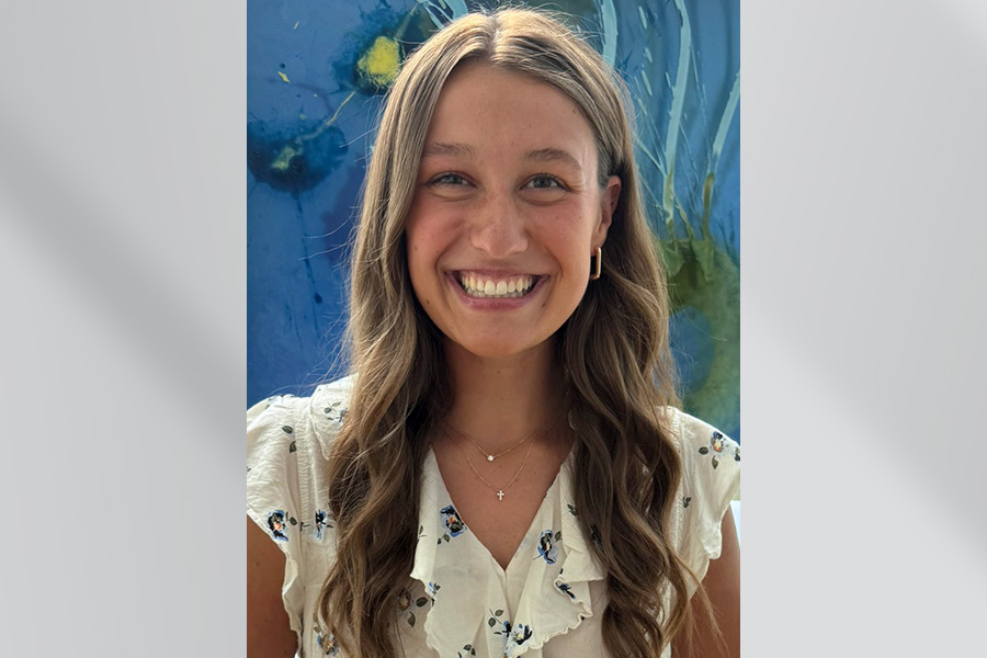 woman with long brown hair and white shirt