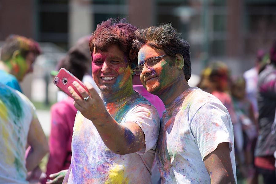 Students celebrate the Holi Festival