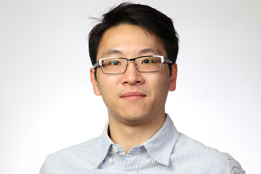 Calvin Lam poses for a headshot