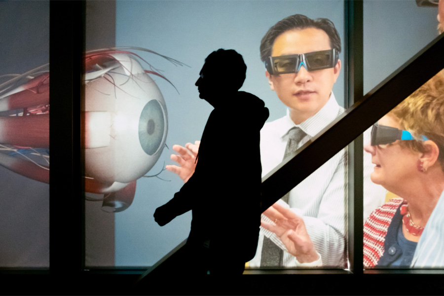 A student walks past a promotional banner