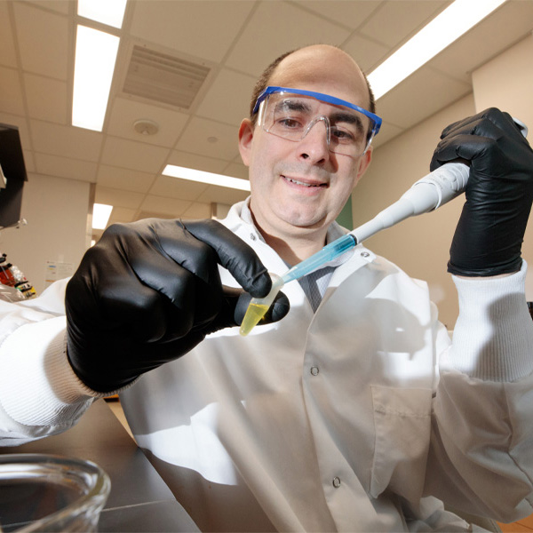 A man works with research equipment