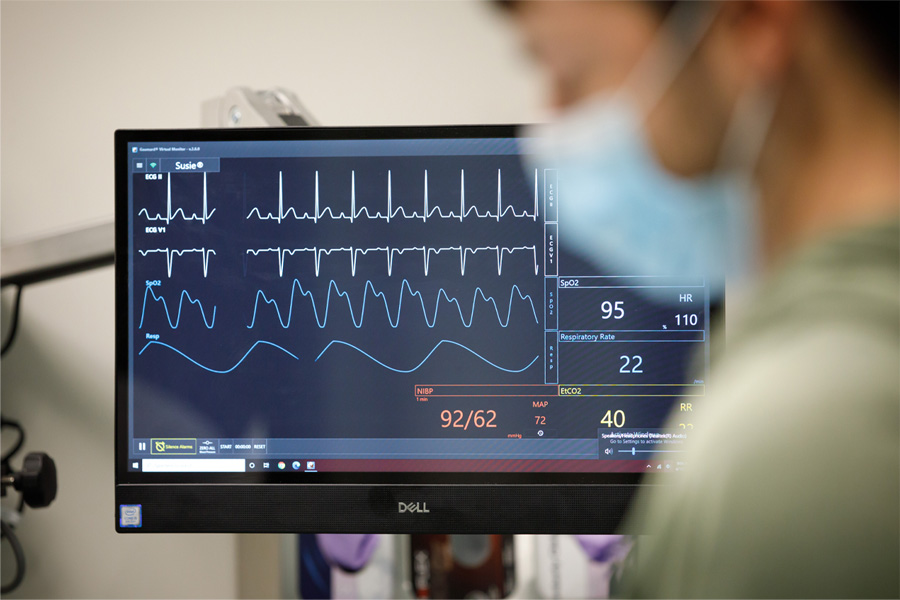A monitor displays patient vitals