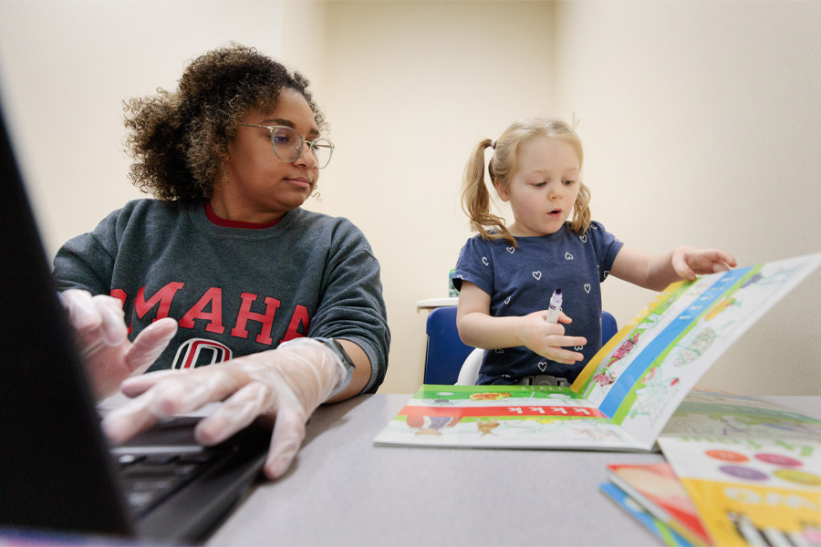 A student works with an MMI patient