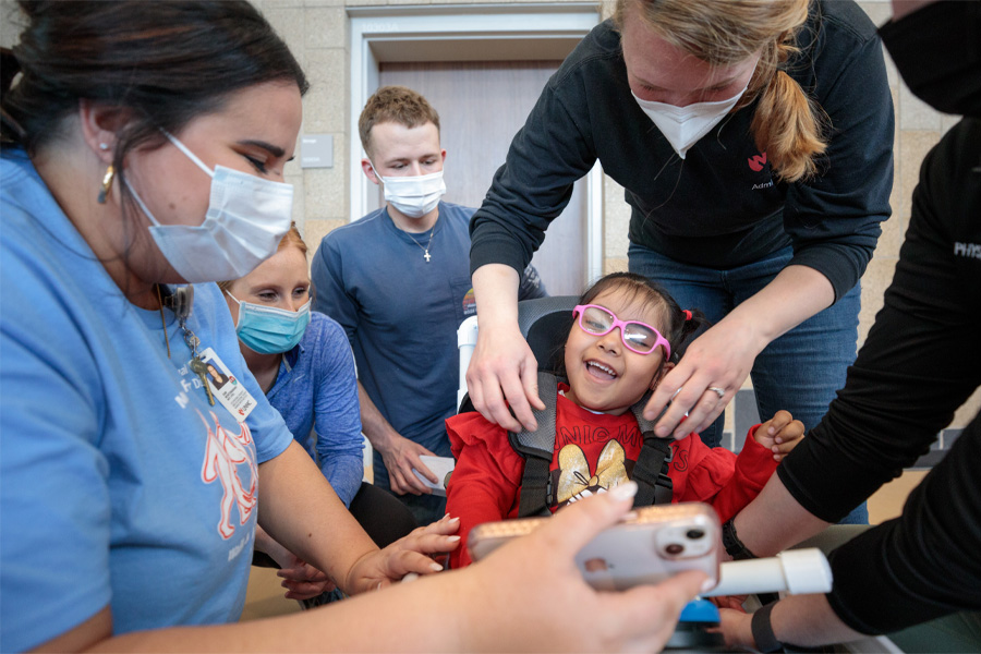 Staff and students work with an MMI patient