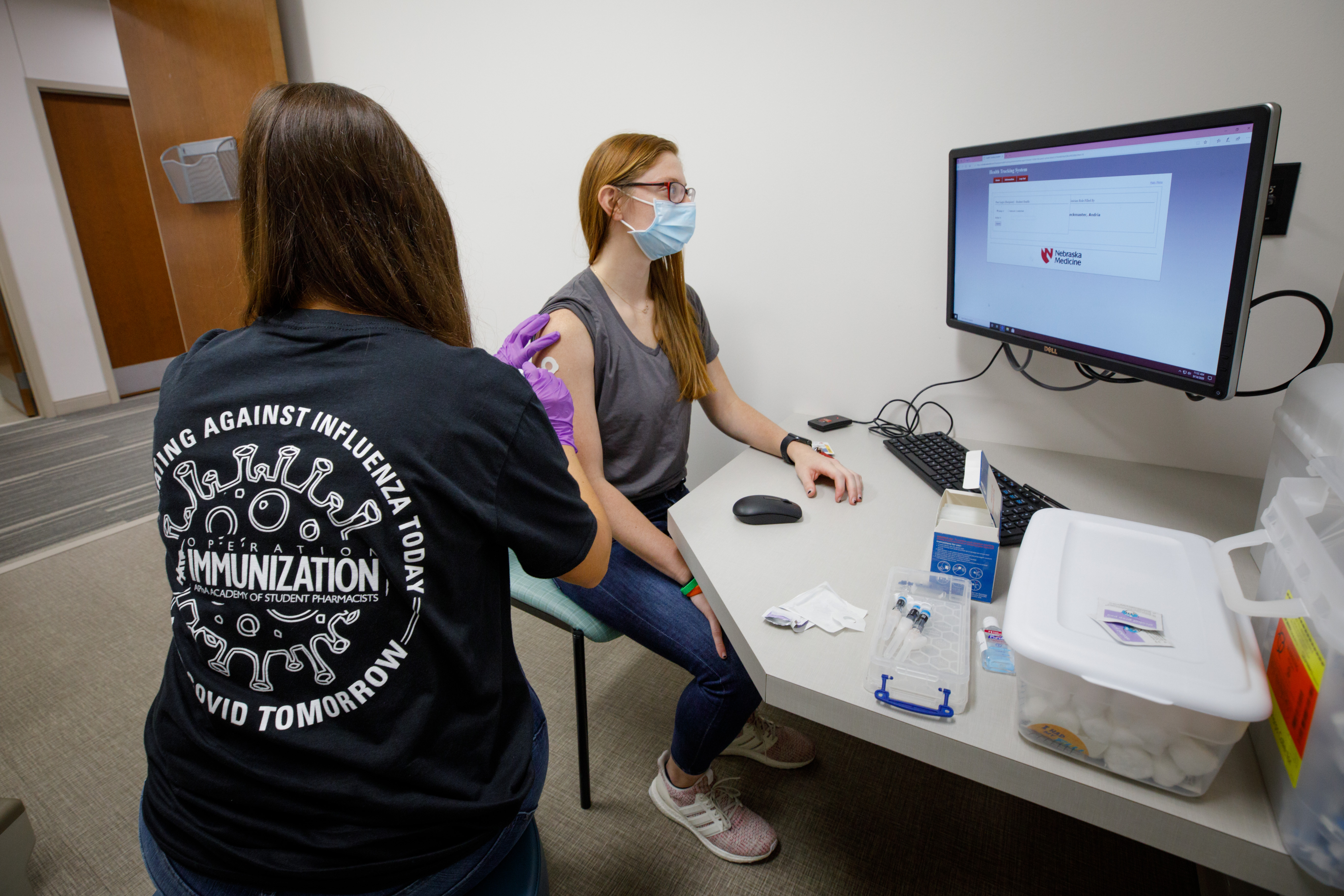 A woman receives a vaccine