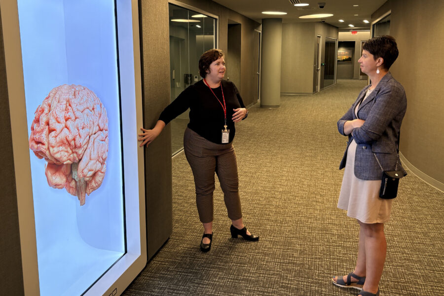 Cindy Johnson receives a tour of UNMCs iEXCEL. 