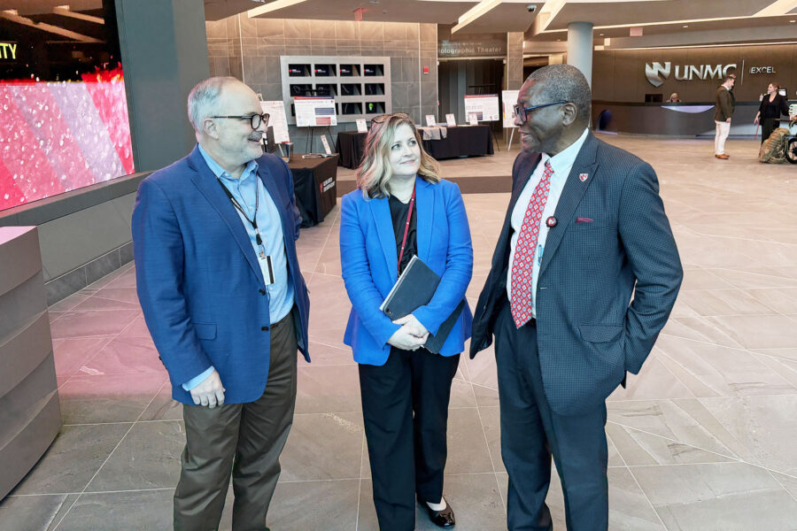 Among those attending the expo were, from left, James Lawler, MD, associate director for international programs and innovation with the Global Center for Health Security, Jane Meza, PhD, UNMC's interim vice chancellor for academic affairs, and UNMC Interim Chancellor H. Dele Davies, MD.
