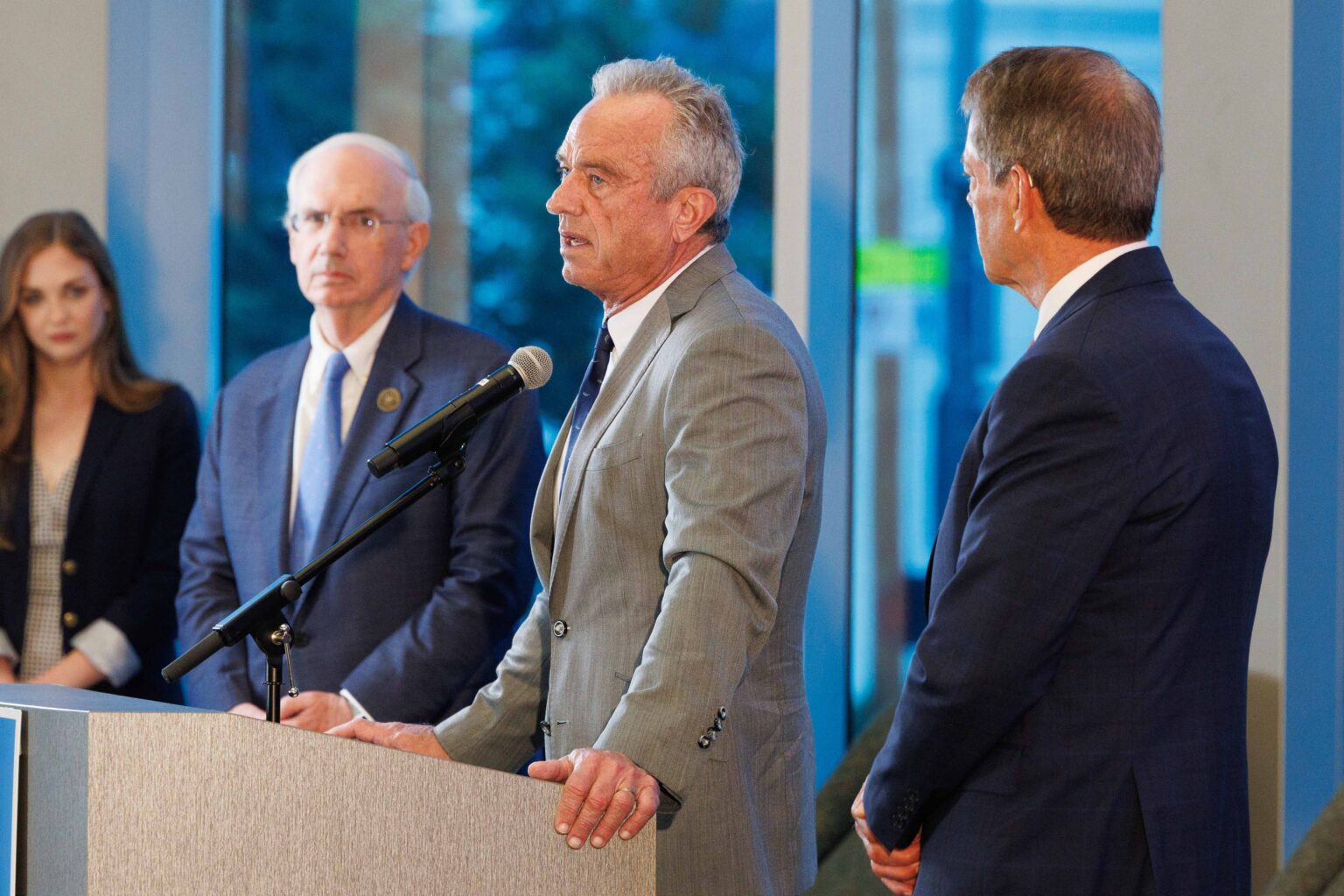 U.S. Department of Health and Human Services Secretary Robert F. Kennedy, Jr. is flanked by University of Nebraska President Jeffrey P. Gold, MD, left, and Gov. Jim Pillen, right, during a news conference Thursday in the Davis Global Center.