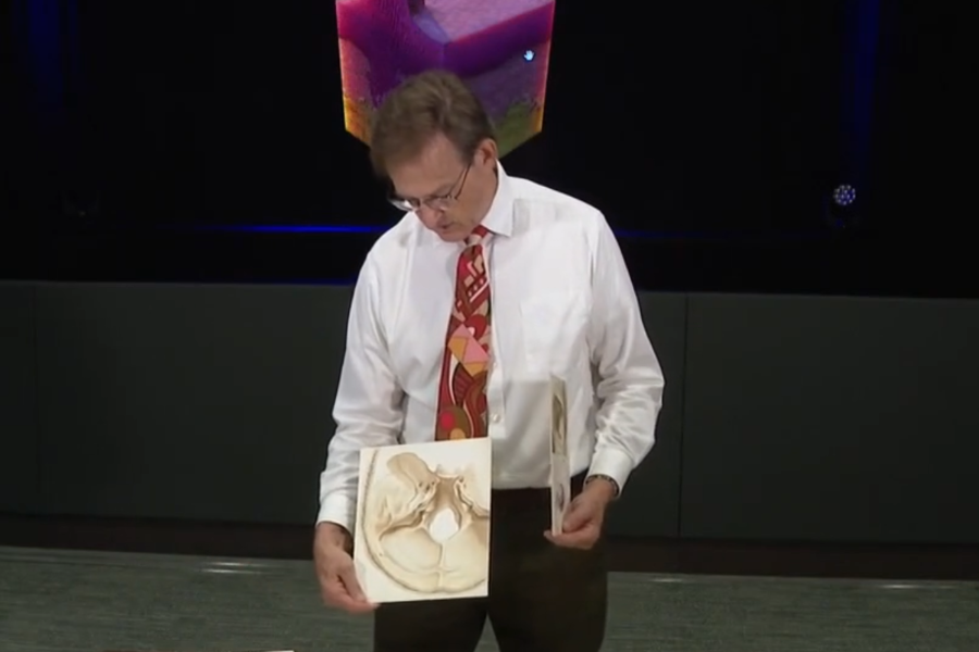 Bill Glass displaying his hand drawn art